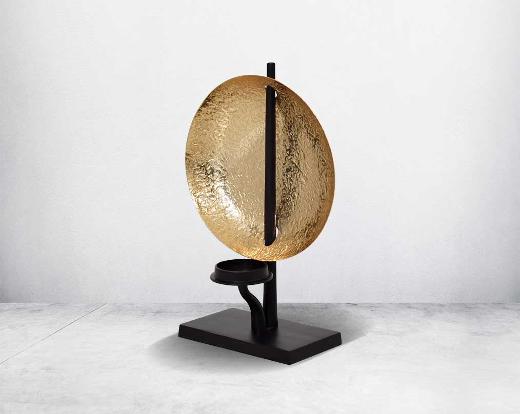 This retro-modern candle/pillar holder is crafted in antique brass with the candle holder in matt black adding a timeless mood to any space.