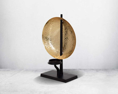 This retro-modern candle/pillar holder is crafted in antique brass with the candle holder in matt black adding a timeless mood to any space.