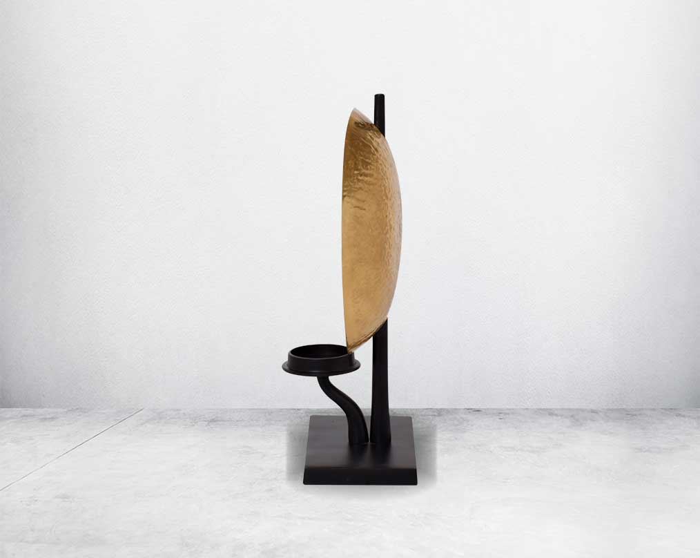 This retro-modern candle/pillar holder is crafted in antique brass with the candle holder in matt black adding a timeless mood to any space.