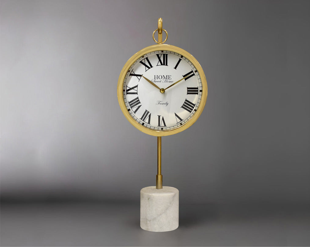 Round clock suspended on a hook in glossy gold & white marble base with front view 
