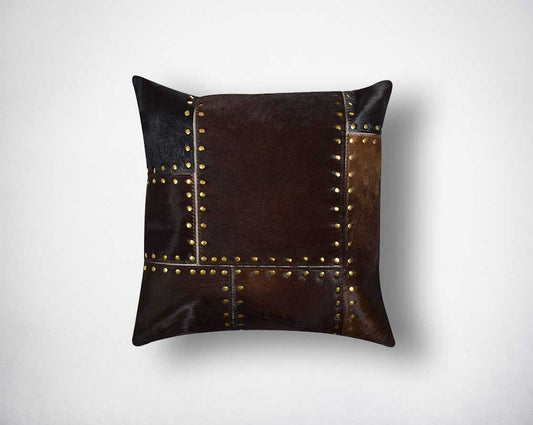 Brown hair on leather cushion with gold rivets.