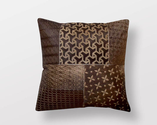 Brown hair on a leather cushion.