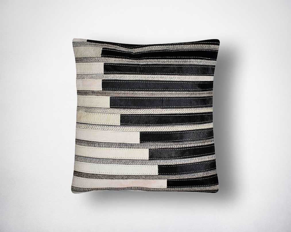White, black & grey hair on the leather cushion.
