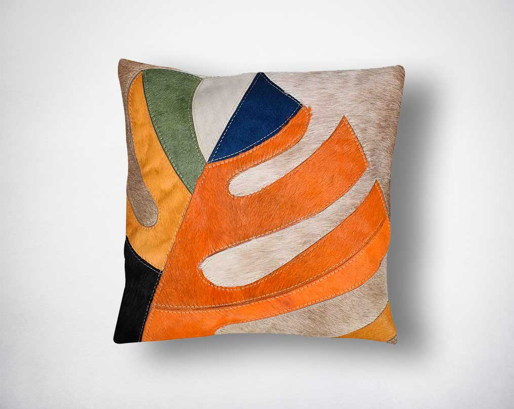 White, beige, yellow, olive green & black hair on the leather cushion.