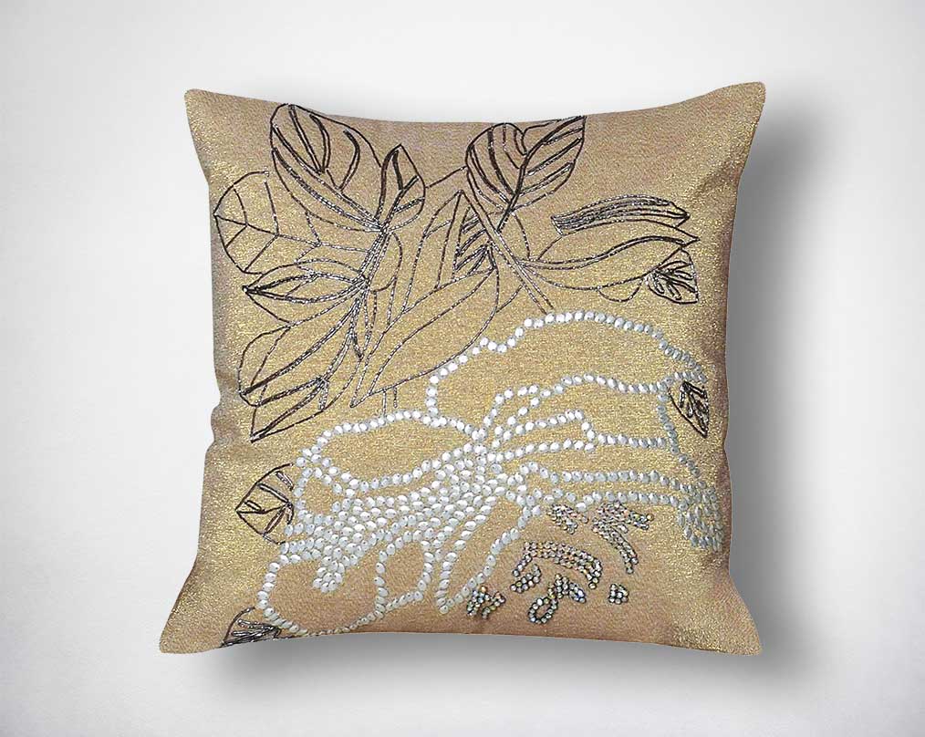 Crème cotton embroidered cushion.