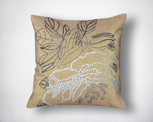 Crème cotton embroidered cushion.