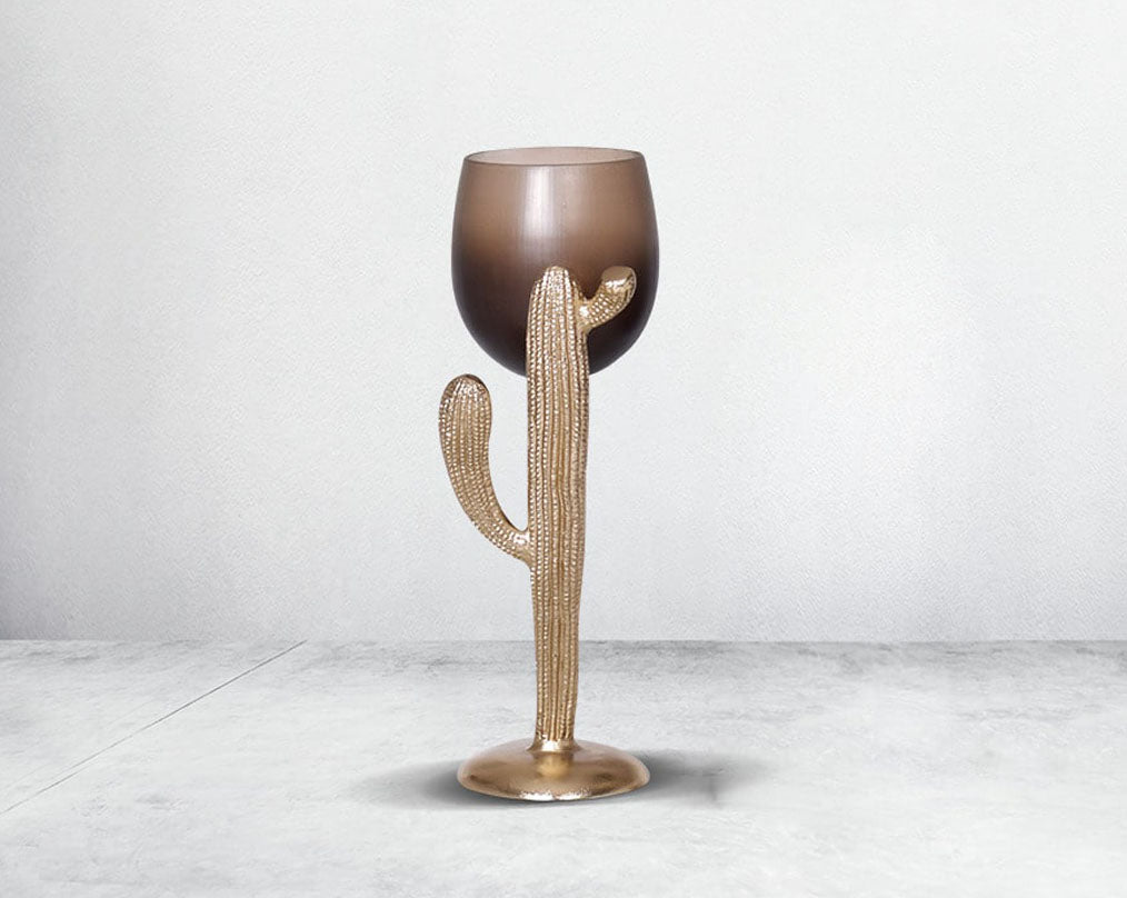 The pillar holder cactus design motif is crafted with green lustre glass with an antique gold finish aluminium decorative base. large 