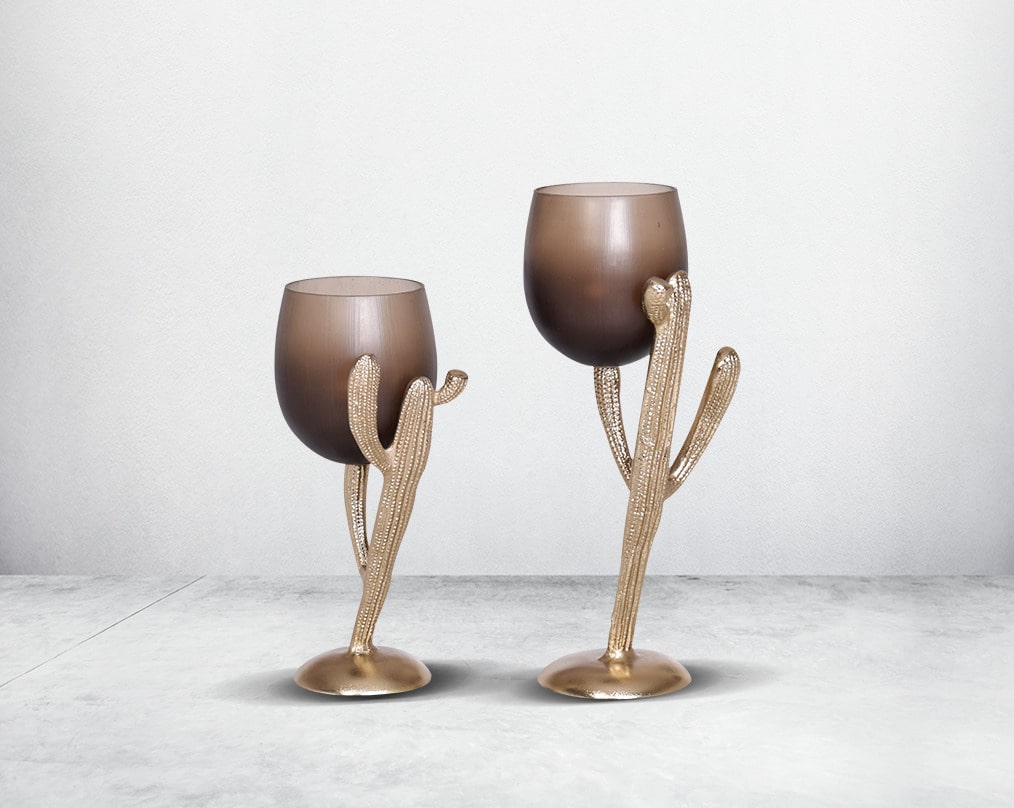 The pillar holder cactus design motif is crafted with green lustre glass with an antique gold finish aluminium decorative base.1 small 2 large 