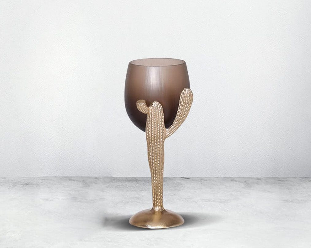 The pillar holder cactus design motif is crafted with green lustre glass with an antique gold finish aluminium decorative base.small