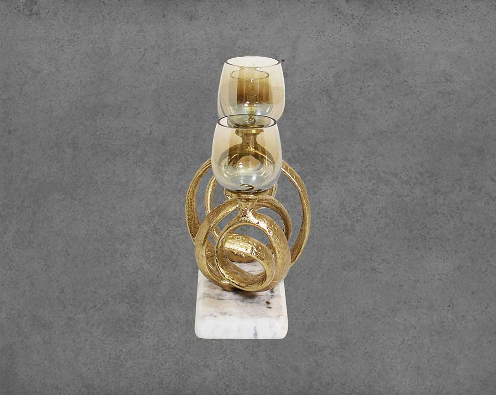 Multi T-light candle holder in gold-finished nickel plated aluminum, smoke luster glass with white marble base.