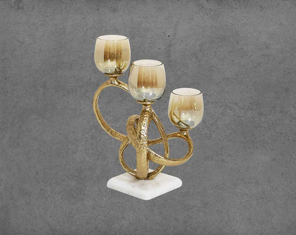 Multi T-light candle holder in gold-finished nickel plated aluminum, smoke luster glass with white marble base.