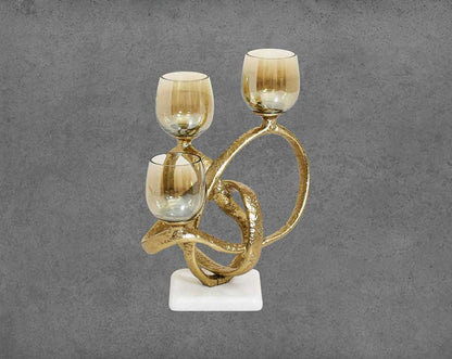 Multi T-light candle holder in gold-finished nickel plated aluminum, smoke luster glass with white marble base front view