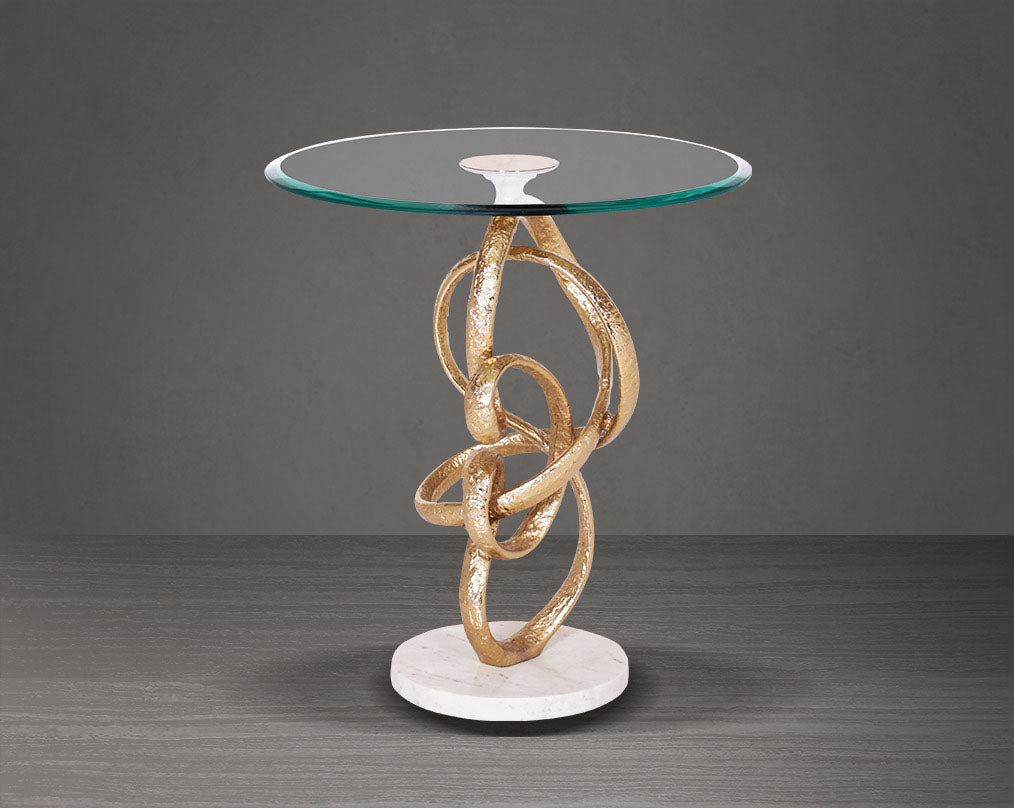 This artful gold accent end table glass top with an amorphously shaped high polished gold pedestal & white marble base.