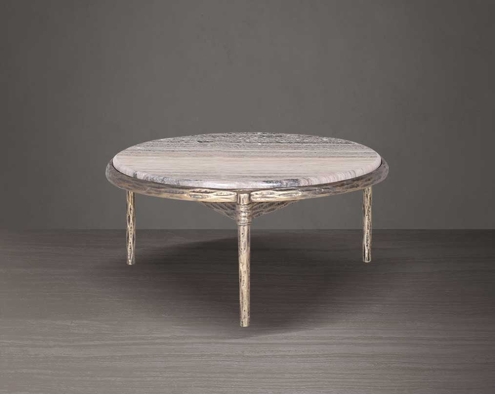 Round marble table with decorative legs on a dark background