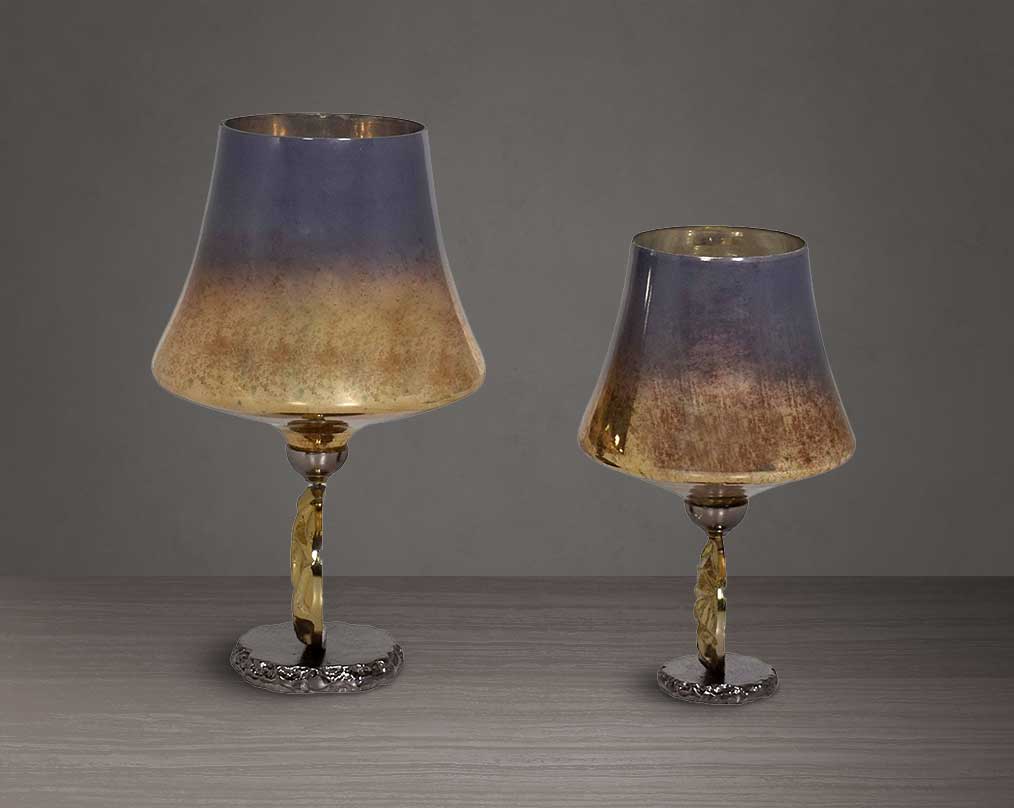 Candle holder in solstice champagne lustre glass and antique nickel-plated textured aluminum decorative base.