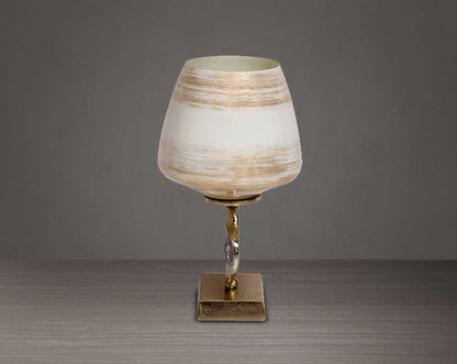 Candle pillar holder in brown luster glass and antique gold plated aluminum decorative base.