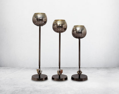 Pillar goblet candle holder in brown lustre glass with nickel-plated textured aluminum decorative base with a zeolite stone motiff " 1 large 2 medium 3 small