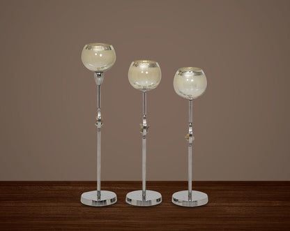 "Pillar goblet candle holder in taupe lustre glass with nickel-plated textured aluminum decorative base. " 1large 2 medium 3 small