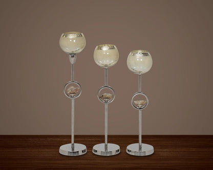 "Pillar goblet candle holder in taupe lustre glass with nickel-plated textured aluminum decorative base. " 1large 2 medium 3 small