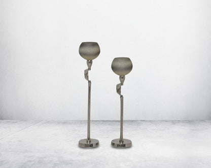 "Pillar goblet candle holder in white & grey luster glass with nickel-plated textured aluminum decorative base. "