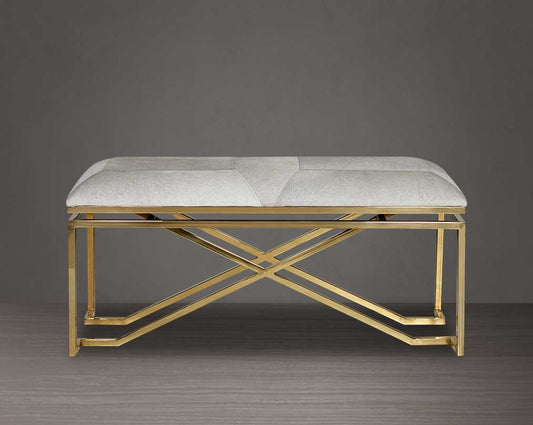 Double bench upholstered in light grey hide seat and high polished gold stainless steel legs in a contemporary, cross design.