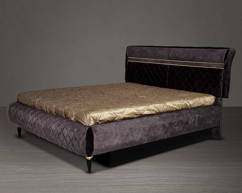 High back bed in king size in dark oak upholstered & quilted in fabric with antique gold design motif in modern classic design. The bed comes with hydraulic lift storage. 
