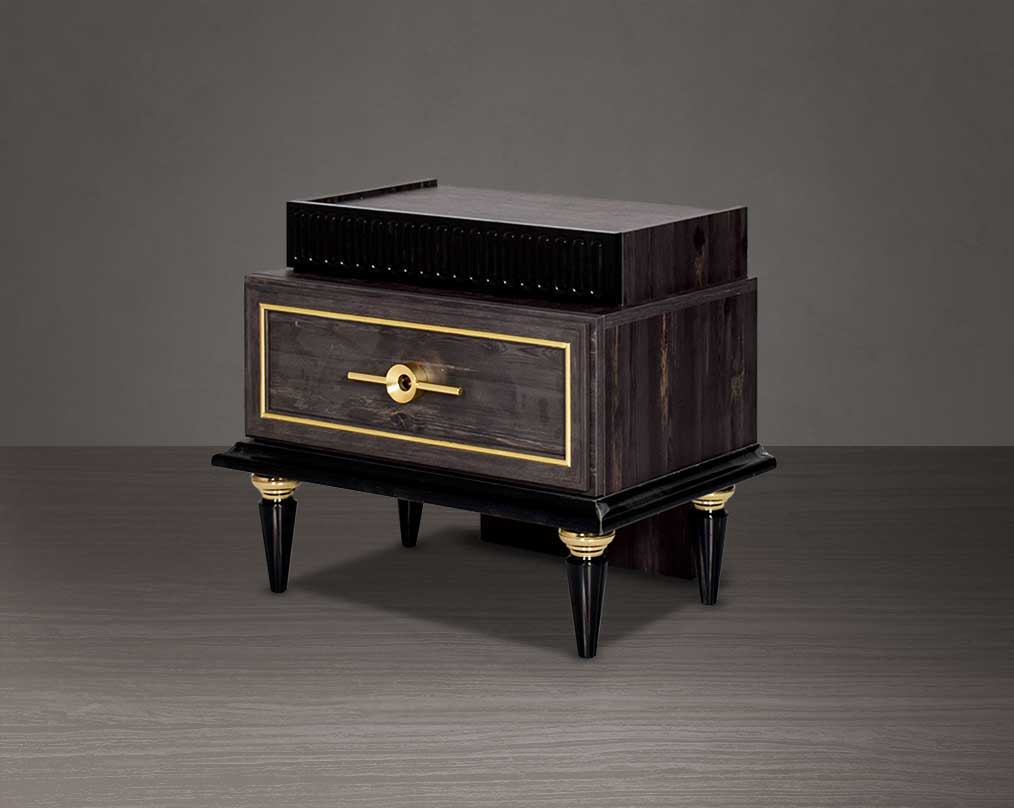 Bedside table in dark oak finish with antique gold design motif and two drawers with golden handles in modern classic design side view