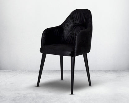 Dining chair upholstered in fabric with legs in wood.