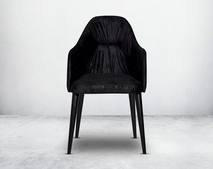 Dining chair upholstered in fabric with front view  legs in wood.