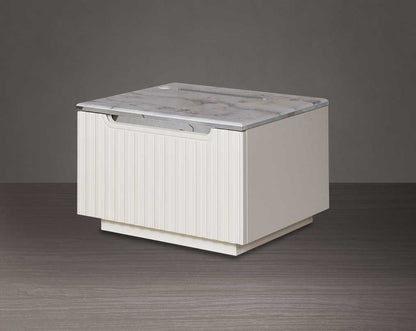 The bedside table comes with a marble finish top & lacquered in high gloss with a spacious drawer with a cream finish handle & base.