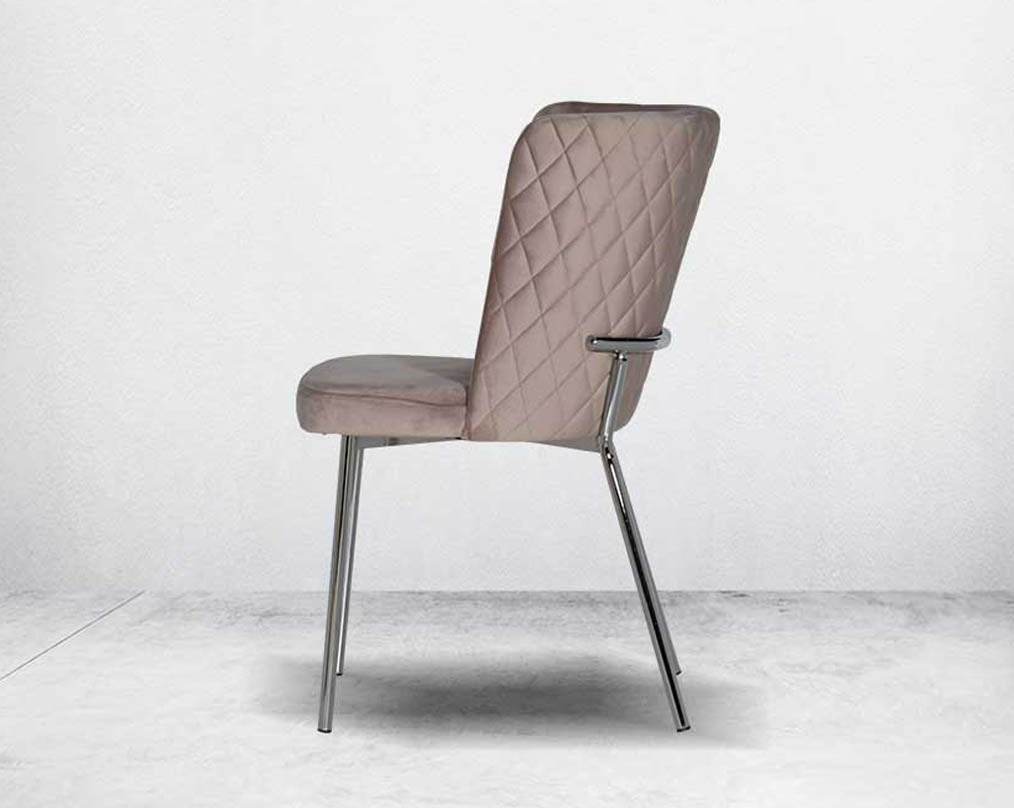 Minimalistically designed chair with criss-cross stitch padded fabric in silver finish stainless steel legs in contemporary design.