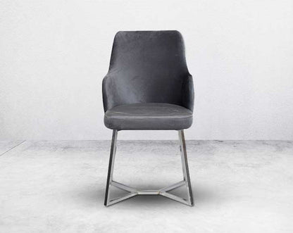 This soft, cushioned dining chair features an extraordinary contemporary design with a tufted back and cushioned seat with stainless steel legs front view