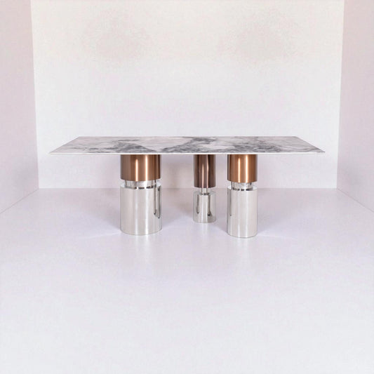 Modern coffee table with marble top and metallic legs on a white background