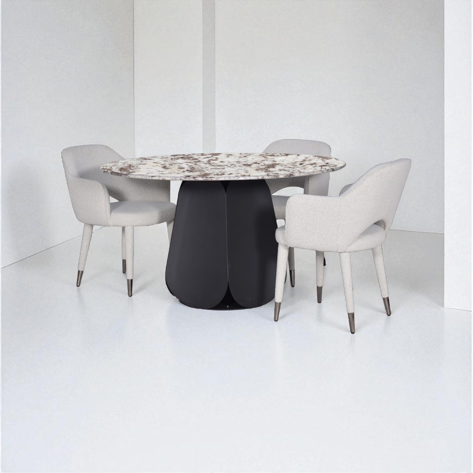 Dining table with a black base and marble top, surrounded by four gray chairs on a white floor and background.