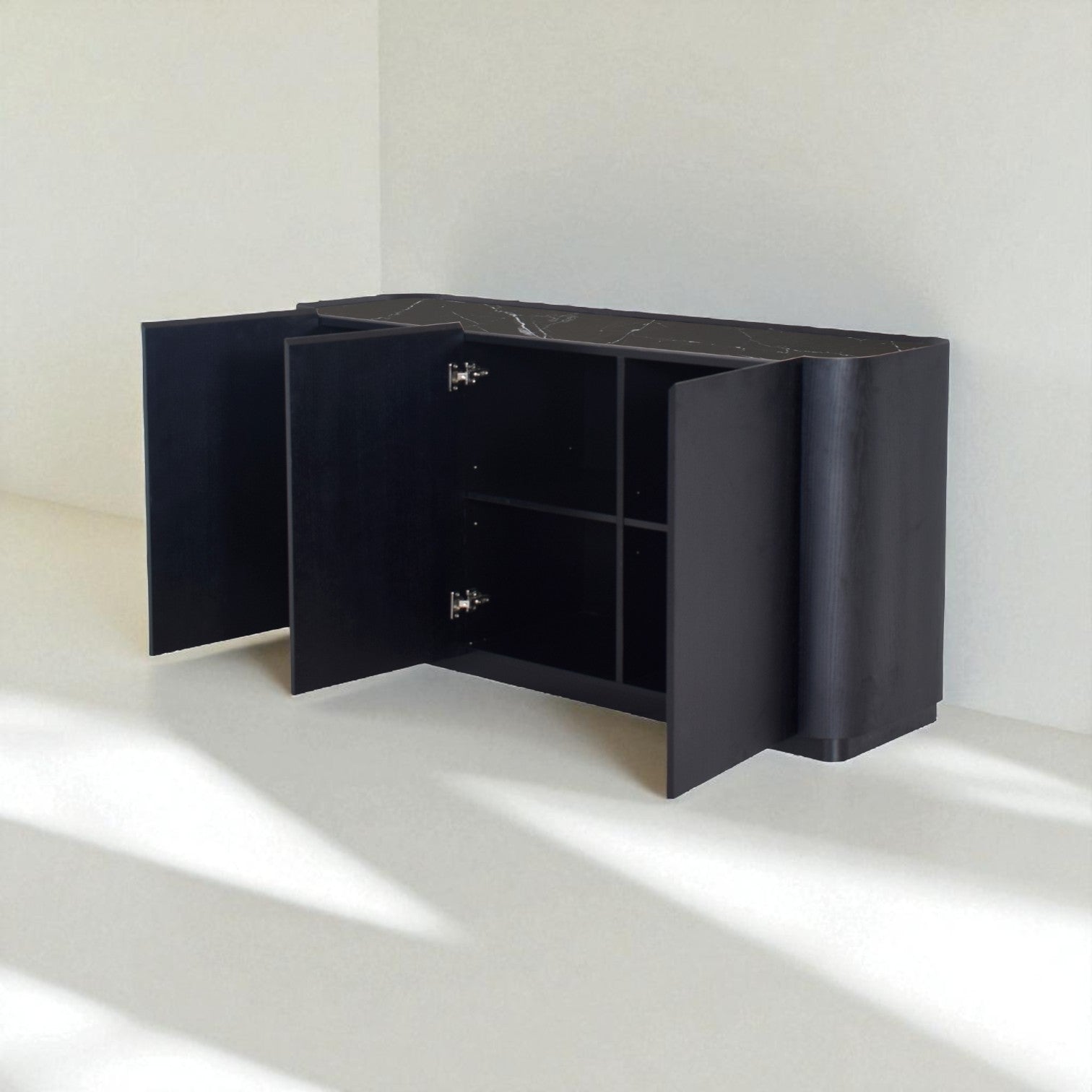 Black cabinet with open doors on a white floor and wall