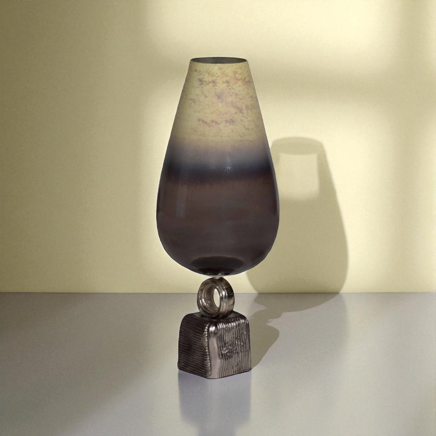 Decorative lamp with a gradient shade on a neutral background