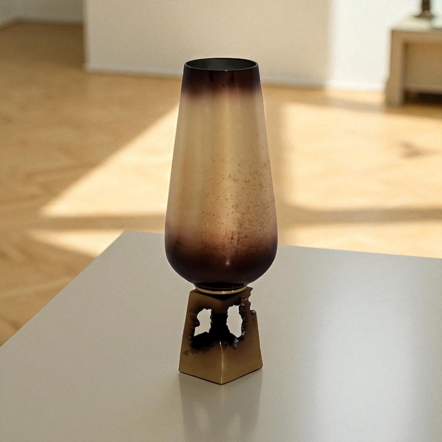 Decorative vase with gradient design on a reflective surface