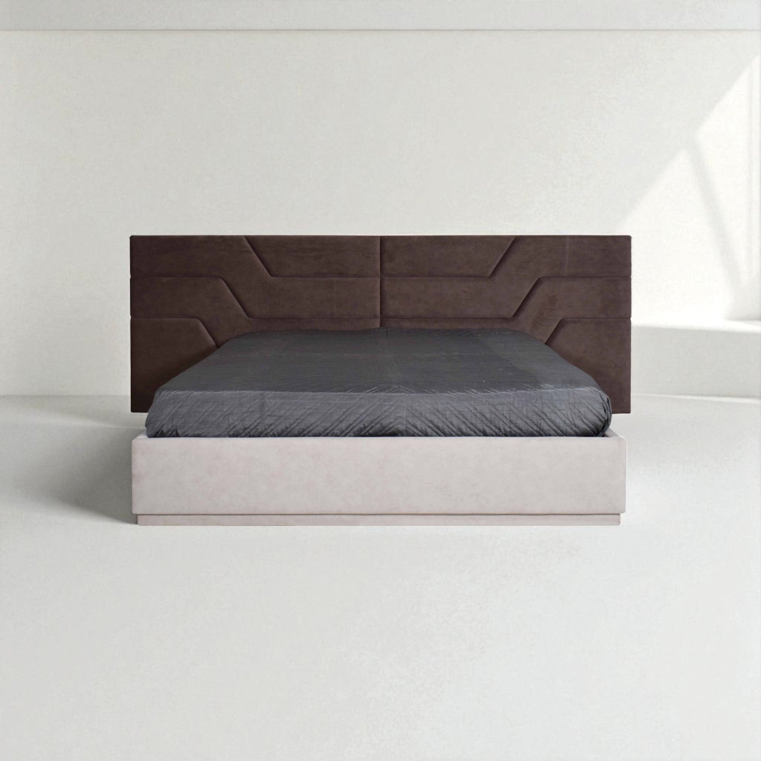 Modern bed with a wide, geometric-patterned brown headboard, light-colored base, and gray bedding in a minimalist white room.