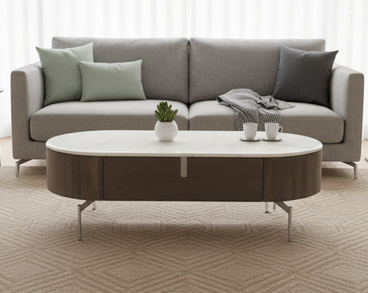 Gray sofa with a round coffee table in a living room setting