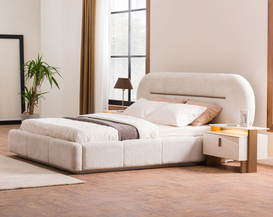 Modern bedroom with a large bed and nightstands.