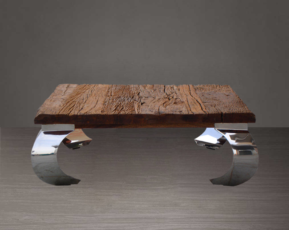 Coffee table with sleeper wood top which has been recycled from railway tracks in a rustic and natural finish with stainless steel base.