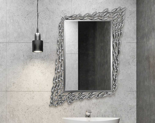 Rectangular wall mirror with silver mirror border in fish-shaped motif in ornamental design.