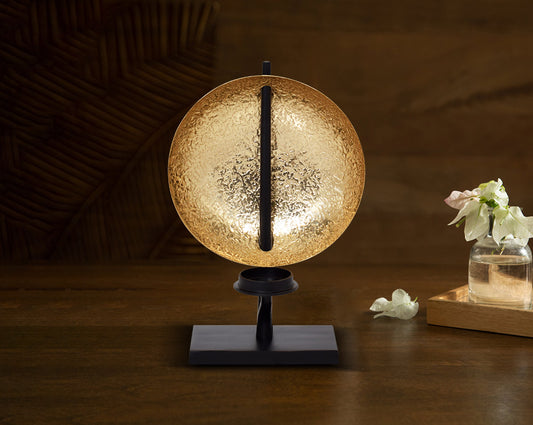 This retro-modern candle/pillar holder is crafted in antique brass with the candle holder in matt black adding a timeless mood to any space with table 