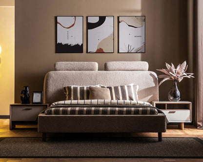 Modern bedroom with a bed, nightstands, and wall art.
